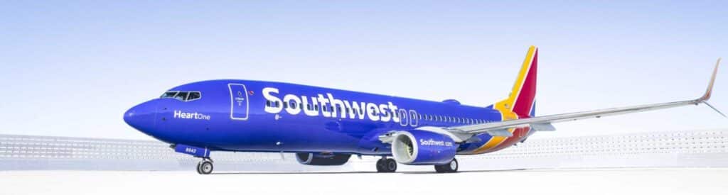 Southwest Airlines aircraft parked under a clear blue sky.