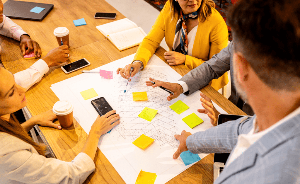 Collaborative brainstorming session using sticky notes for innovative ideas and teamwork.