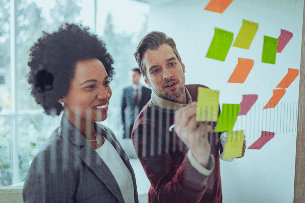 Team collaboration using sticky notes for creative idea generation.