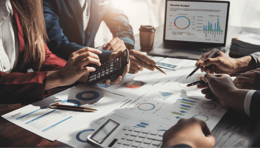 Teams collaborating on business analysis with charts, reports, and calculators.