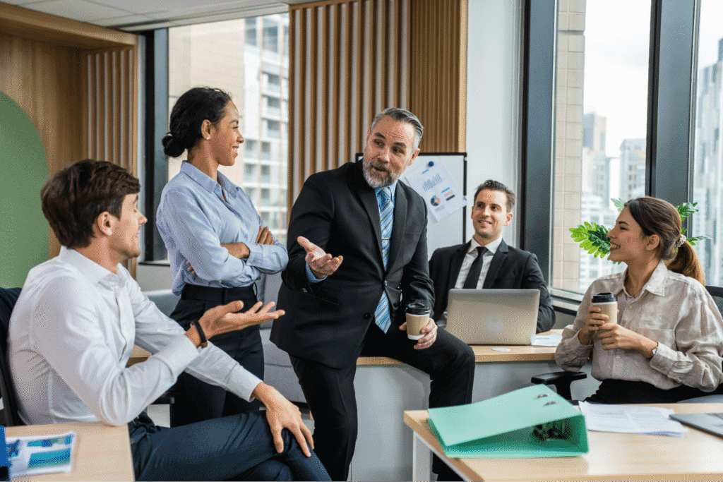 Leader of agile transformation with team brainstorming during a business meeting in a modern office.