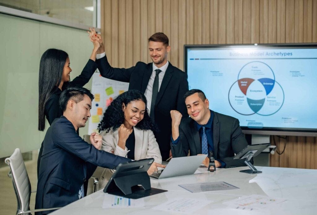 Diverse team collaborates to improve sales KPIs through innovative solutions and teamwork.