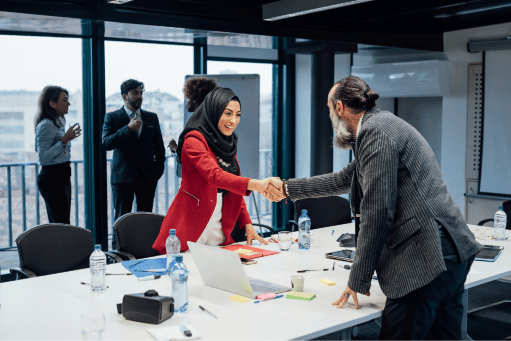 Business partners shaking hands in a productive meeting.