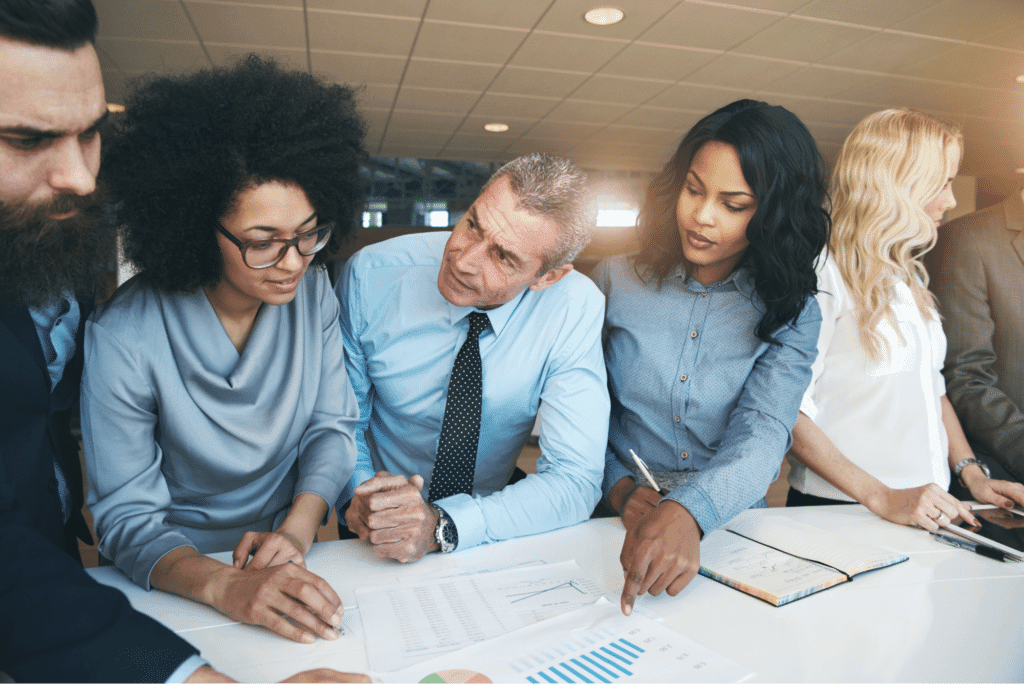 Team collaboration during a productive meeting with charts and discussions.