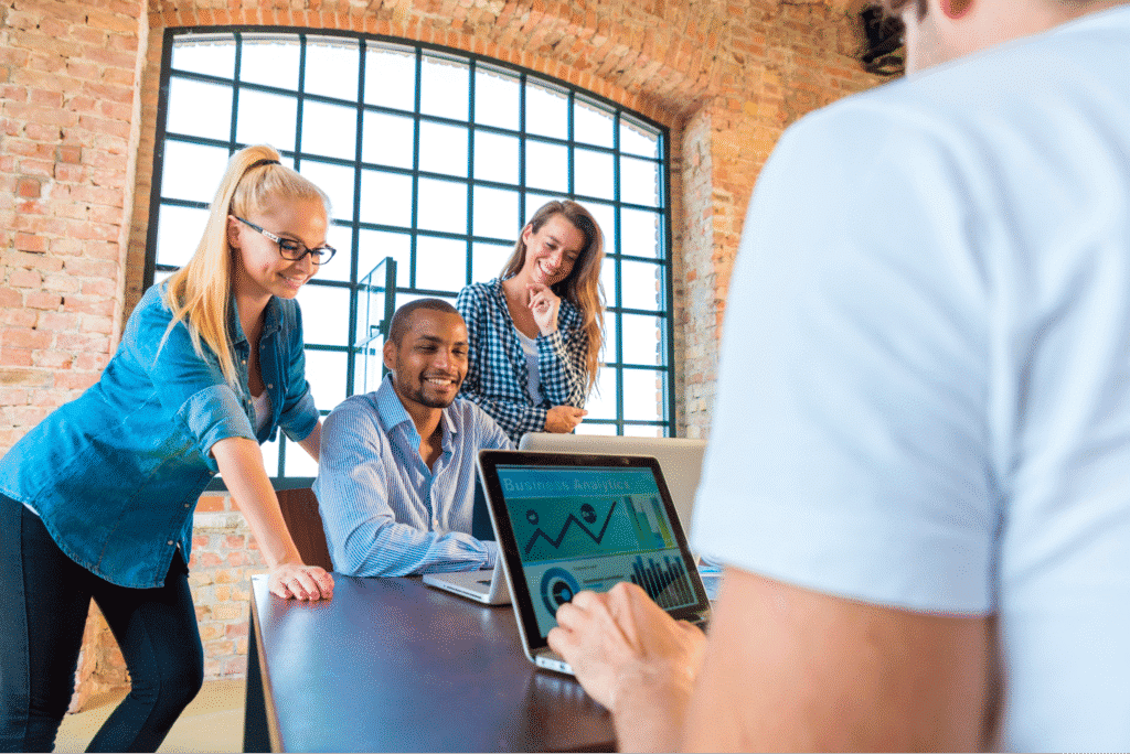 Team collaboration in a modern meeting space with engaged participants discussing data. Team productivity concept.