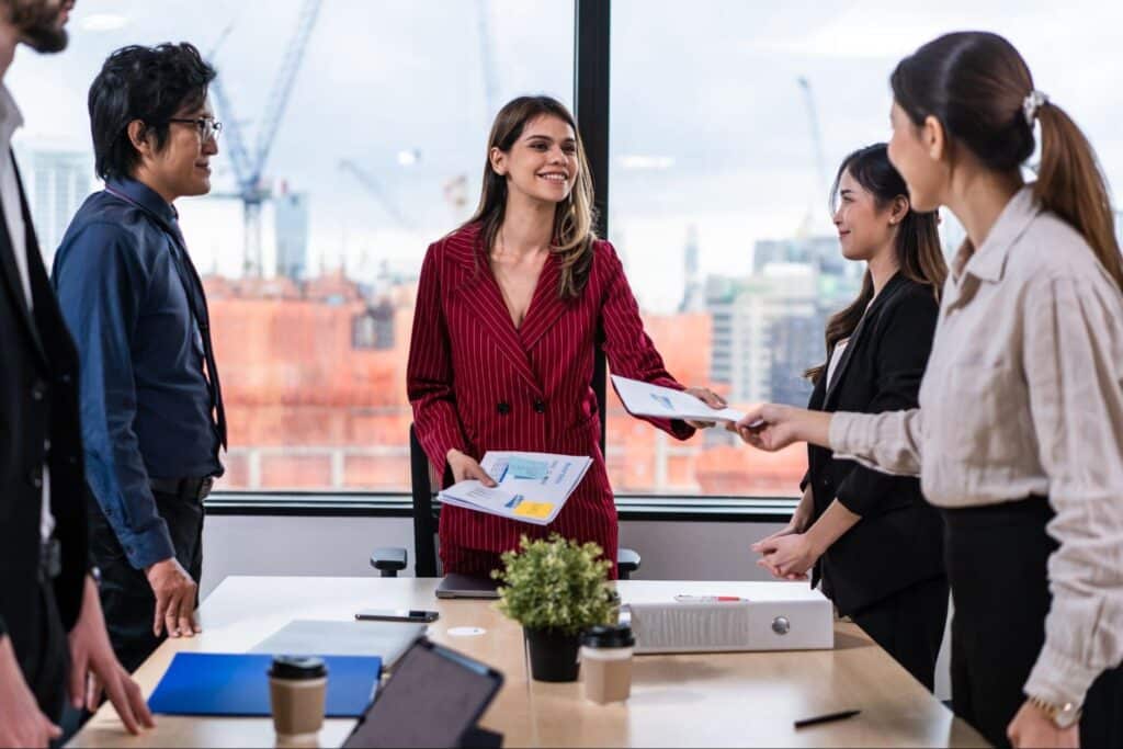 Business team collaborating around a table, discussing project strategy and ideas.