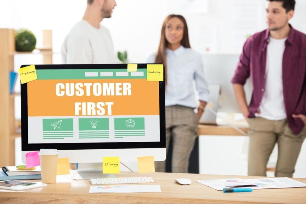 Team collaborating on customer-centric strategies displayed on a computer screen.