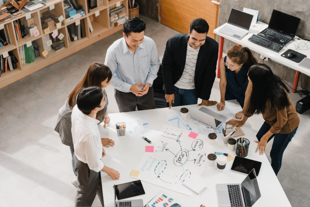 Creative team brainstorming and collaborating in a modern office setting.