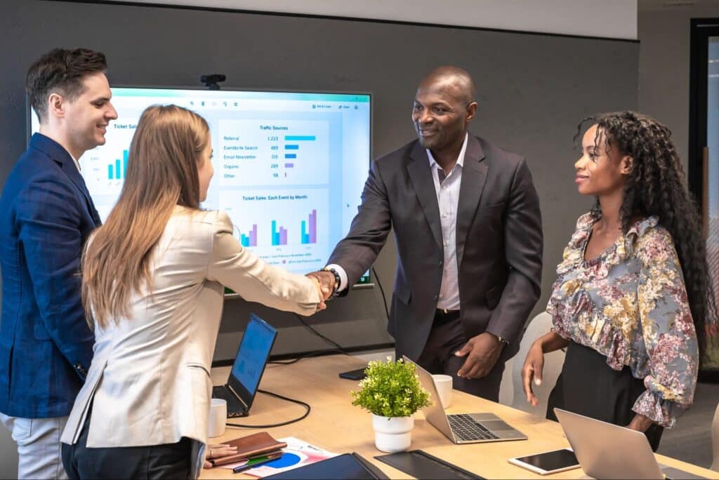 Team collaboration and handshake during a successful business meeting.