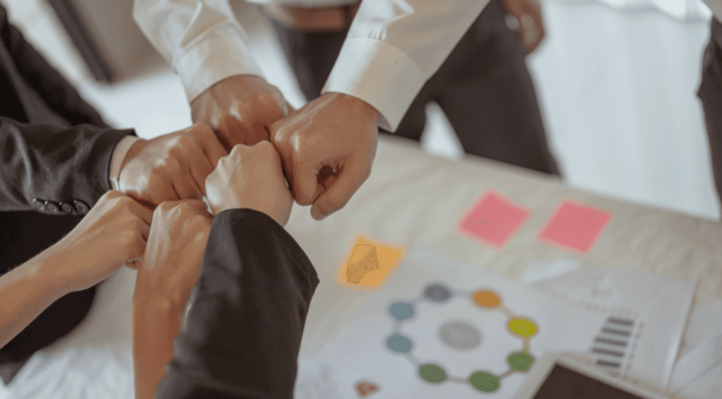 Team members collaborating and supporting each other to achieve common goals.