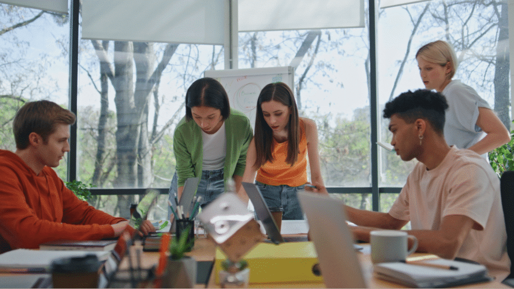 Agile team collaborating in a vibrant office, sharing ideas and strategizing for success.