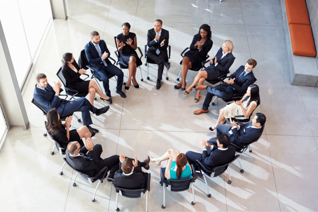 Team engaged in dynamic discussion within a stylish modern meeting space.