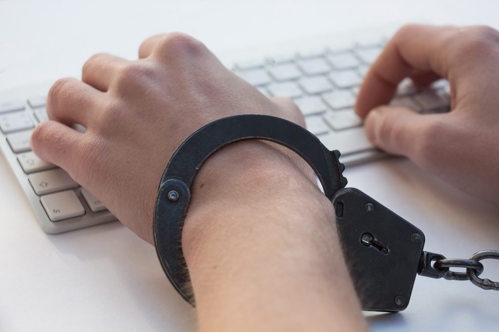 Man handcuffed to his keyboard - Agile Tester