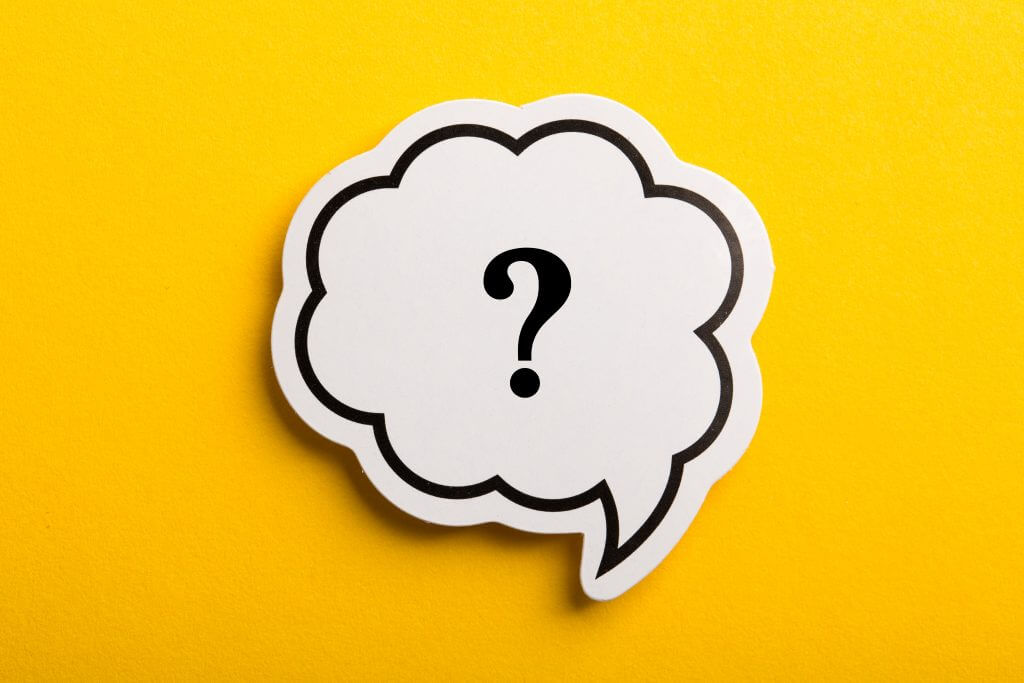 A single question mark in a thought bubble is against a solid yellow background, representing the most important question to ask for a successful Agile transformation. For leaders during an Agile transformation, the question of why the organization is going Agile is vital. Without this compelling reason for change, the transformation runs the risk of losing steam and failing.