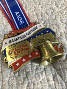 Andy's medal showing he completed the Philly AACR, his second full marathon.