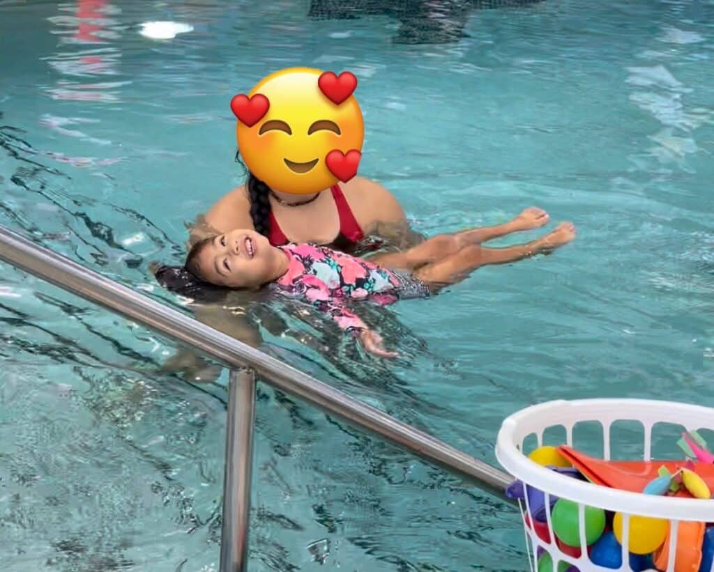 Image of kid learning how to swim while mother thinks about agile transformation