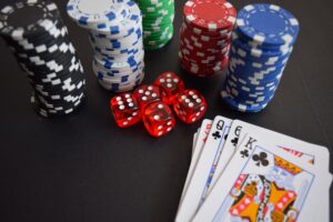 A picture of chips, dice, and cards to symbolize Monte Carlo simulation