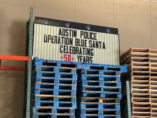 sign celebrating 50 years of Operation Blue Santa