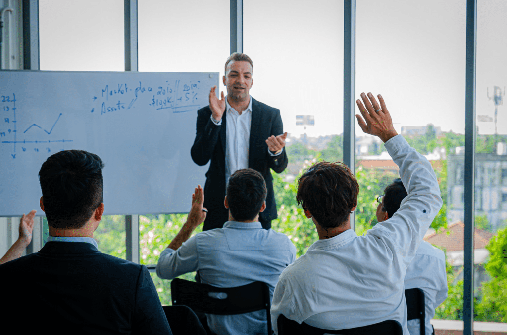 Students actively engage in a modern classroom led by an enthusiastic instructor.