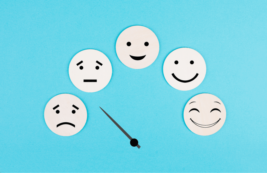 Faces depicting various emotions on a blue background.