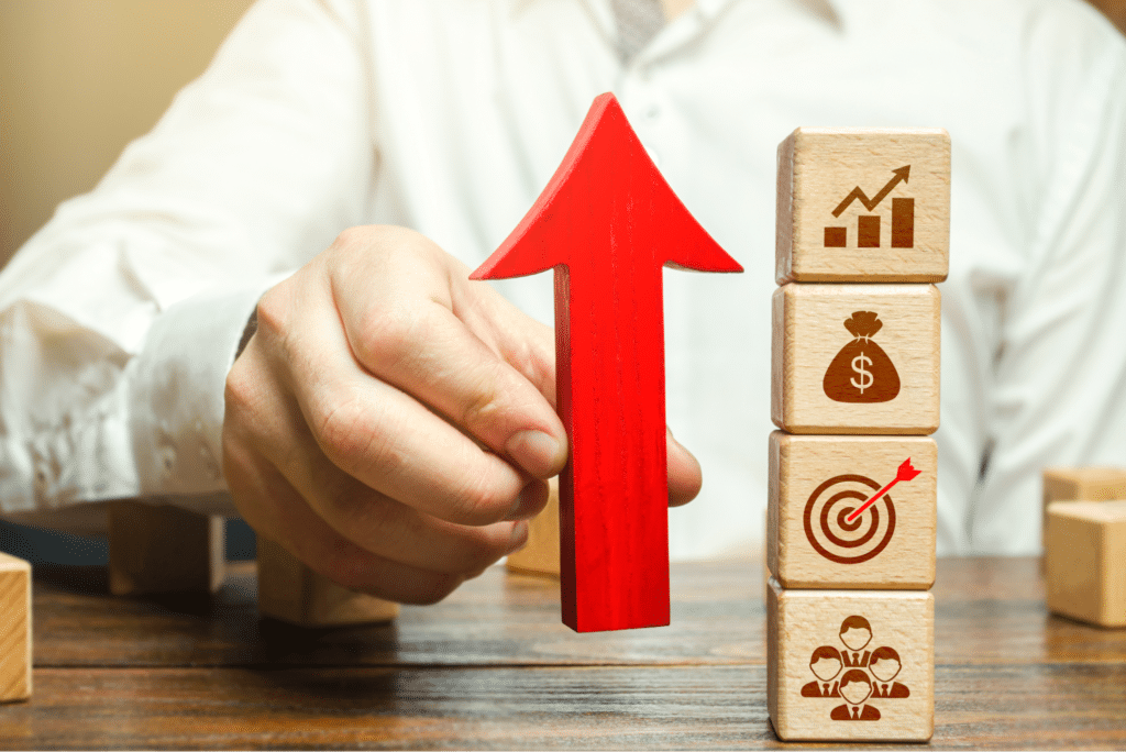 Strategic planning for business growth illustrated by a rising arrow and building blocks.