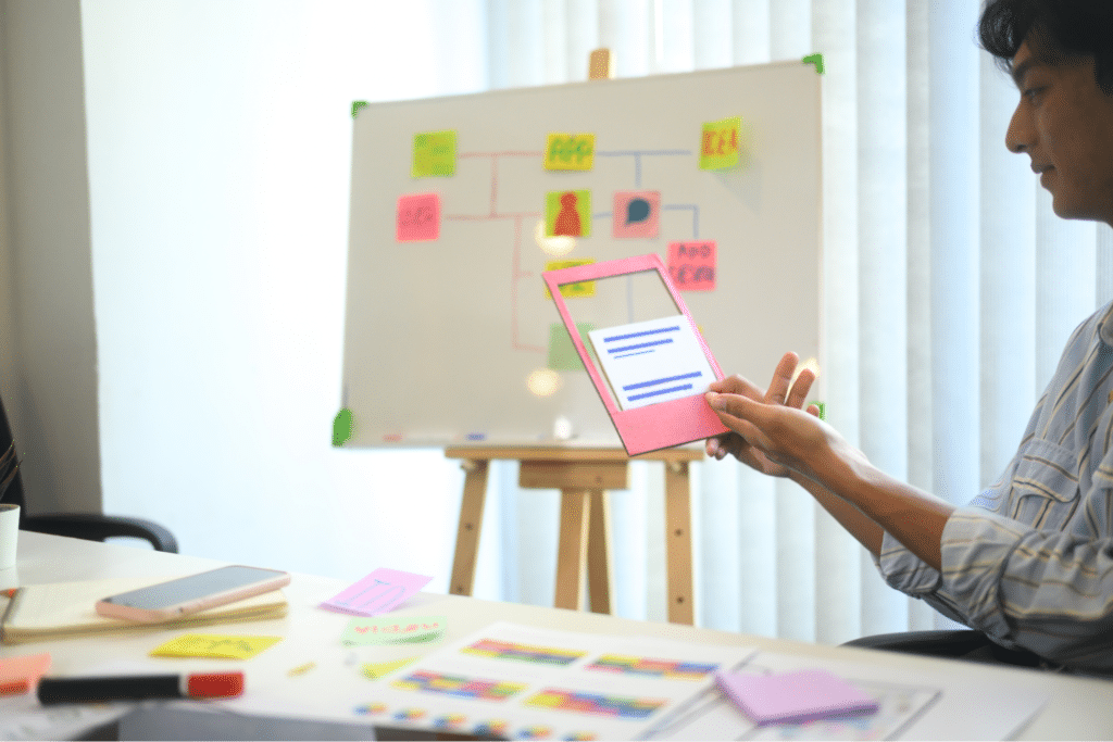 Team collaborating using digital tools and sticky notes for effective planning.