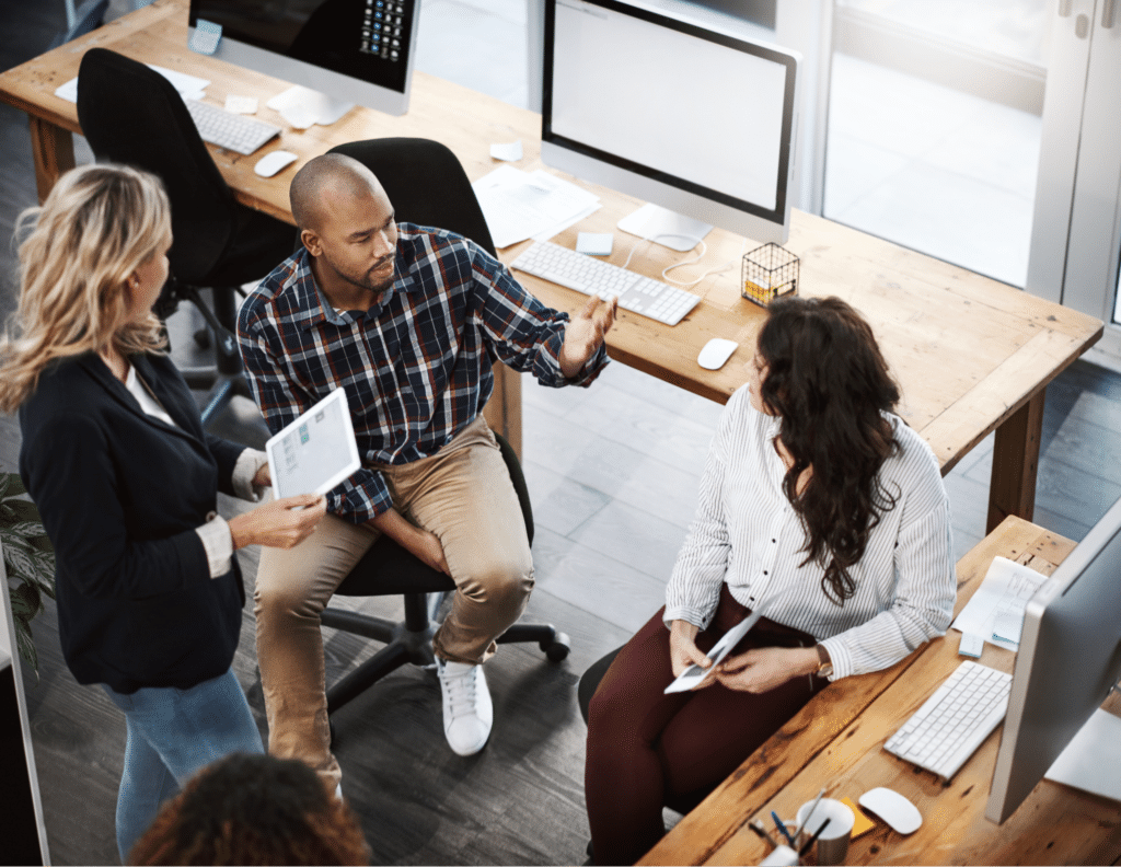 Team brainstorming session in a modern office space.
