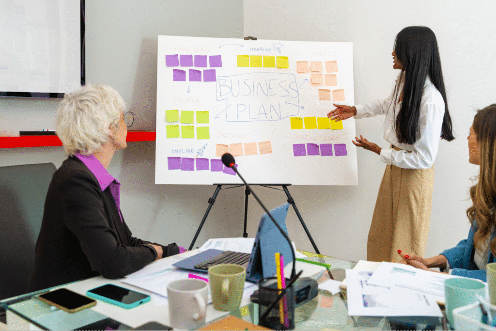 Team collaborating on a business presentation in a professional setting.