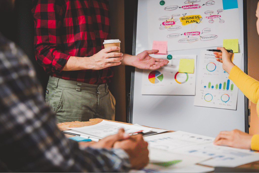 Team brainstorming and analyzing data during a collaborative meeting.