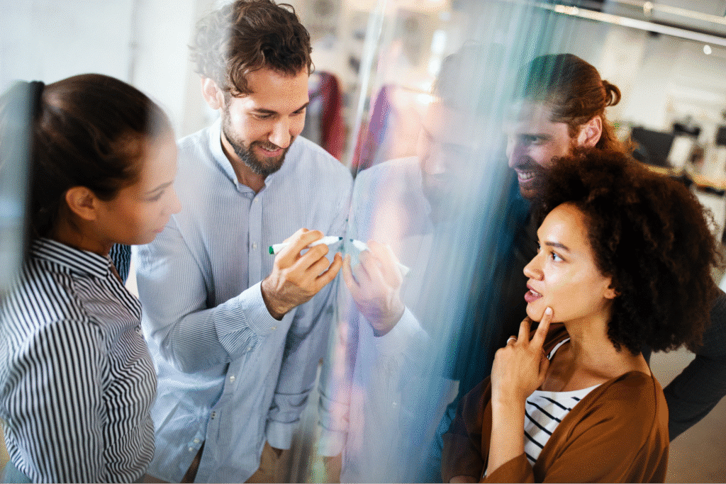 Team collaborating creatively during a brainstorming session in an office environment.
