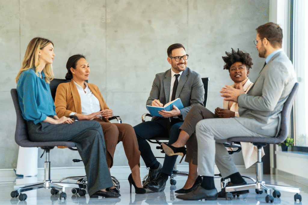 Diverse team discussing product delivery ideas in a modern business meeting.