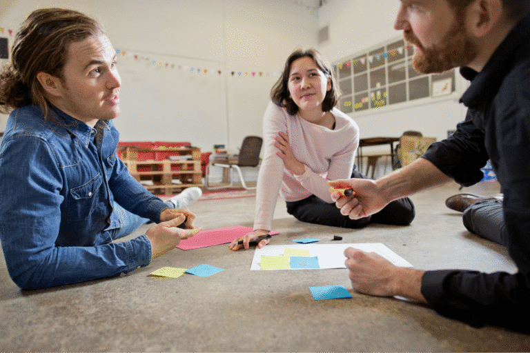Team members engaged in a creative brainstorming session with colorful sticky notes.