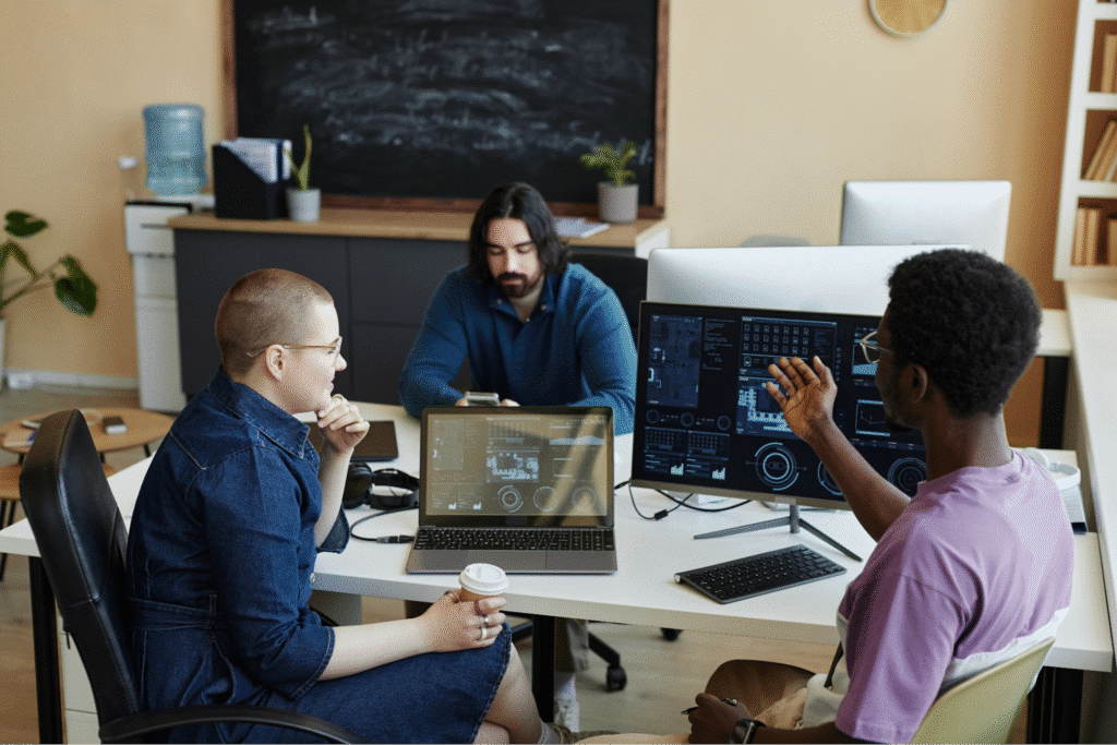 Team collaborating on project insights in a modern office setting.