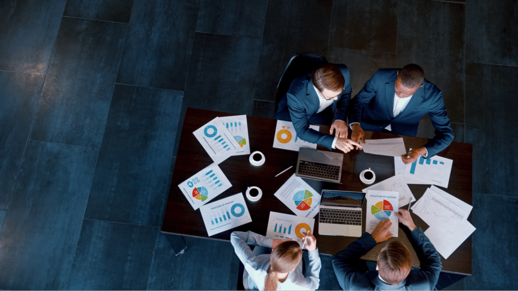 Team discussing business insights and strategies during a 2023 meeting.