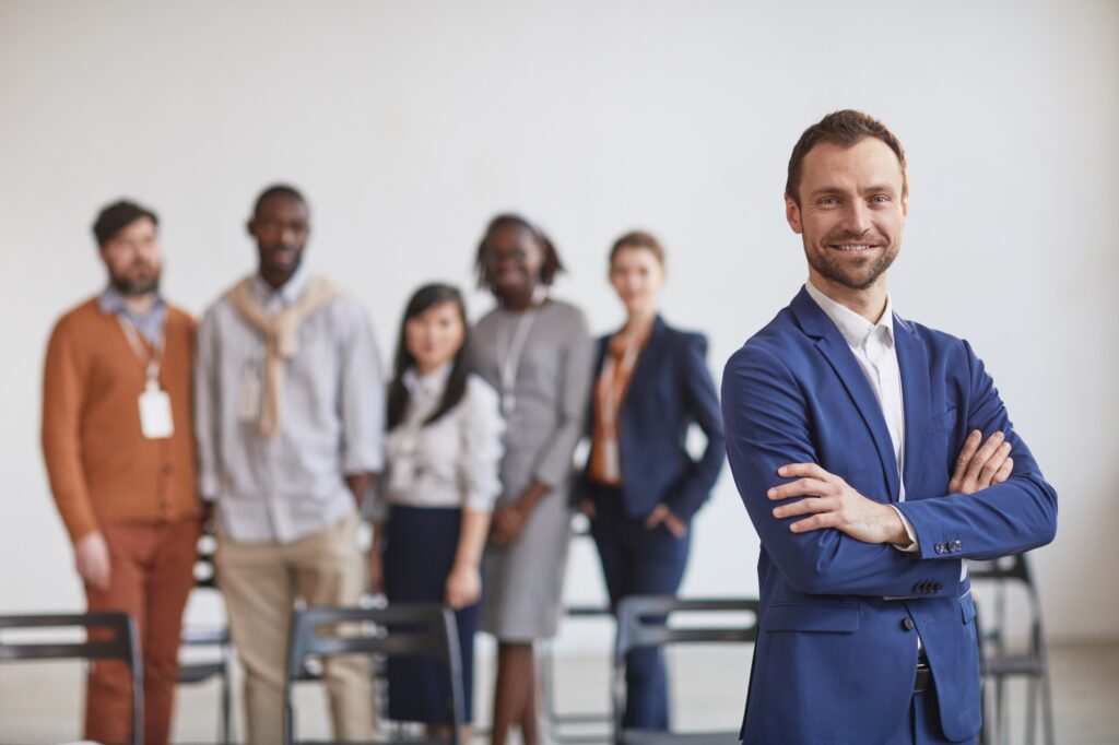 Smiling Business Leader with Team