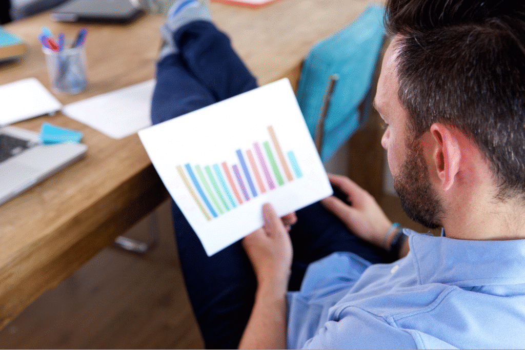 Person analyzing colorful charts and graphs in a modern workspace. portfolio management concept